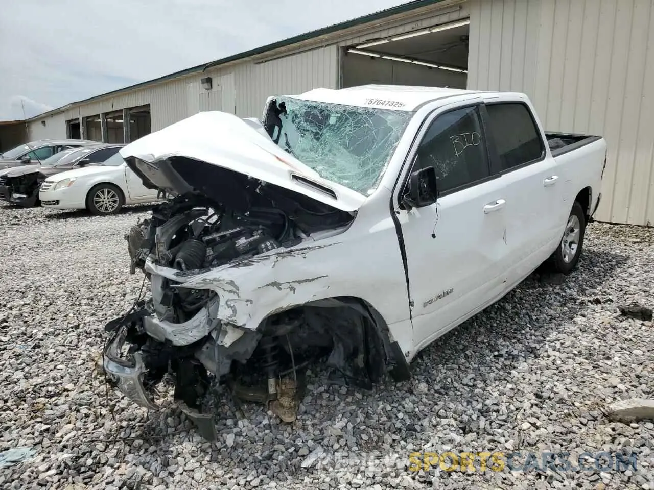1 Photograph of a damaged car 1C6RREFG6MN608488 RAM 1500 2021