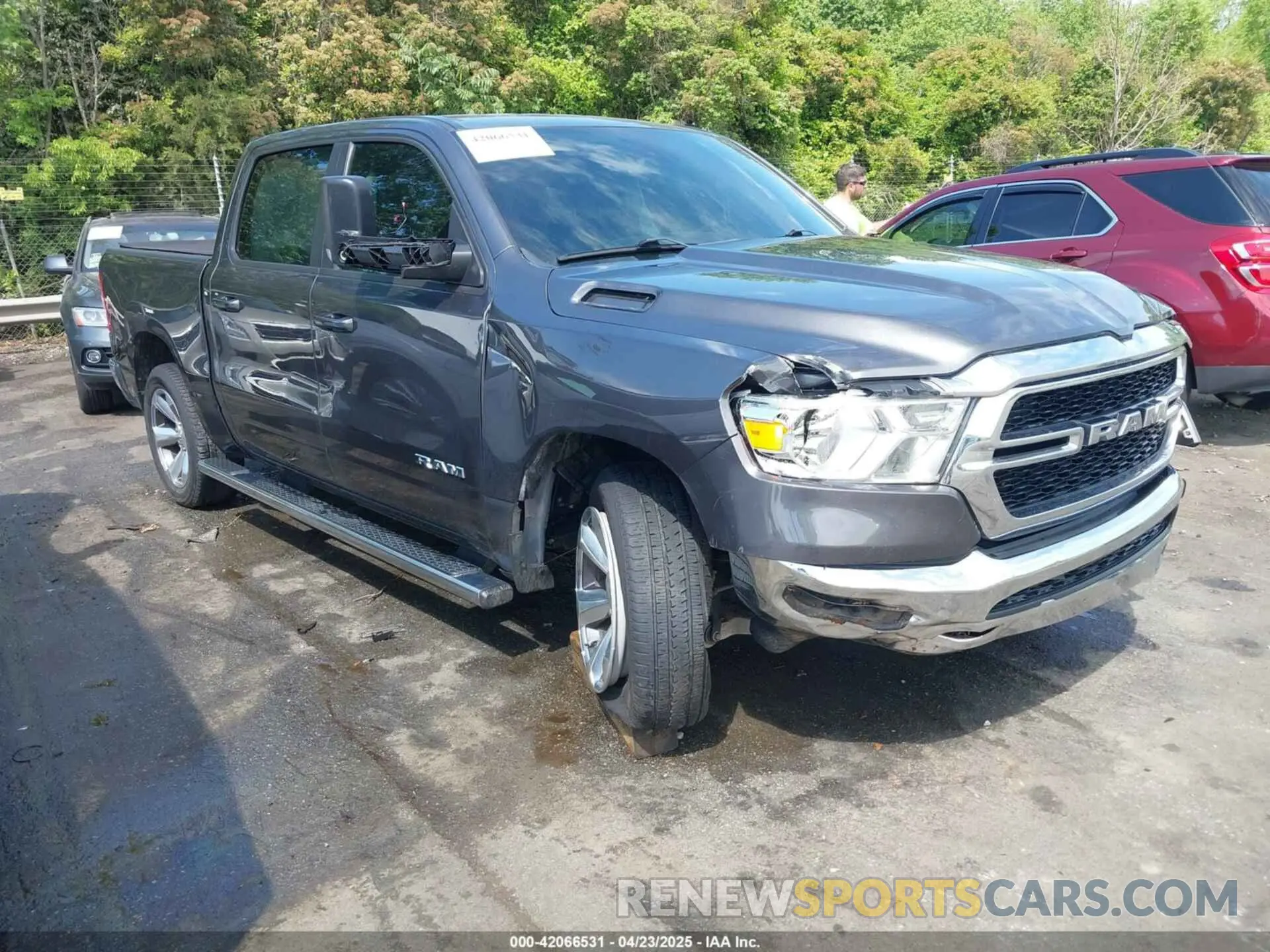 1 Photograph of a damaged car 1C6RREFM5MN813578 RAM 1500 2021