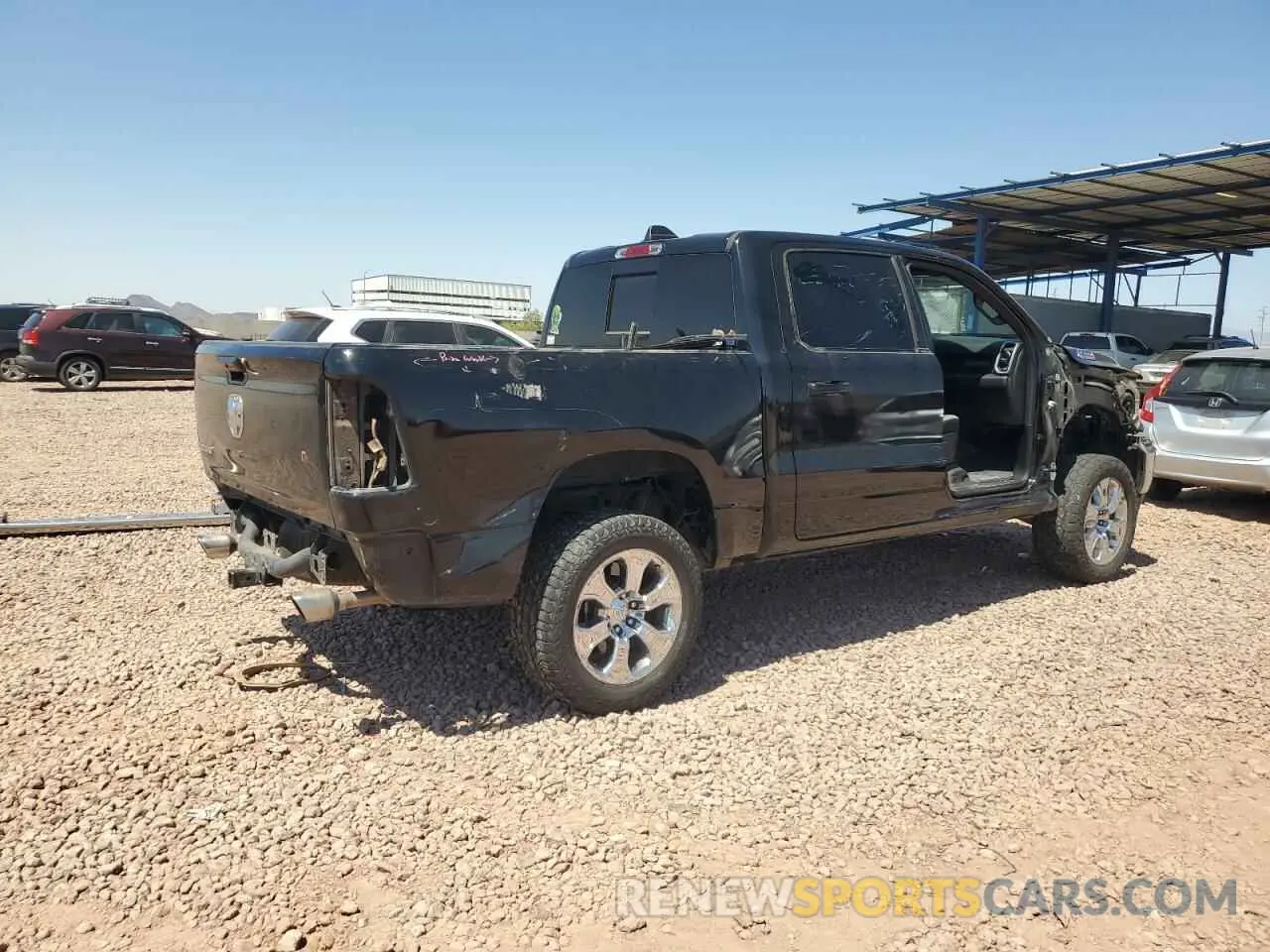 3 Photograph of a damaged car 1C6RREFM7MN712008 RAM 1500 2021