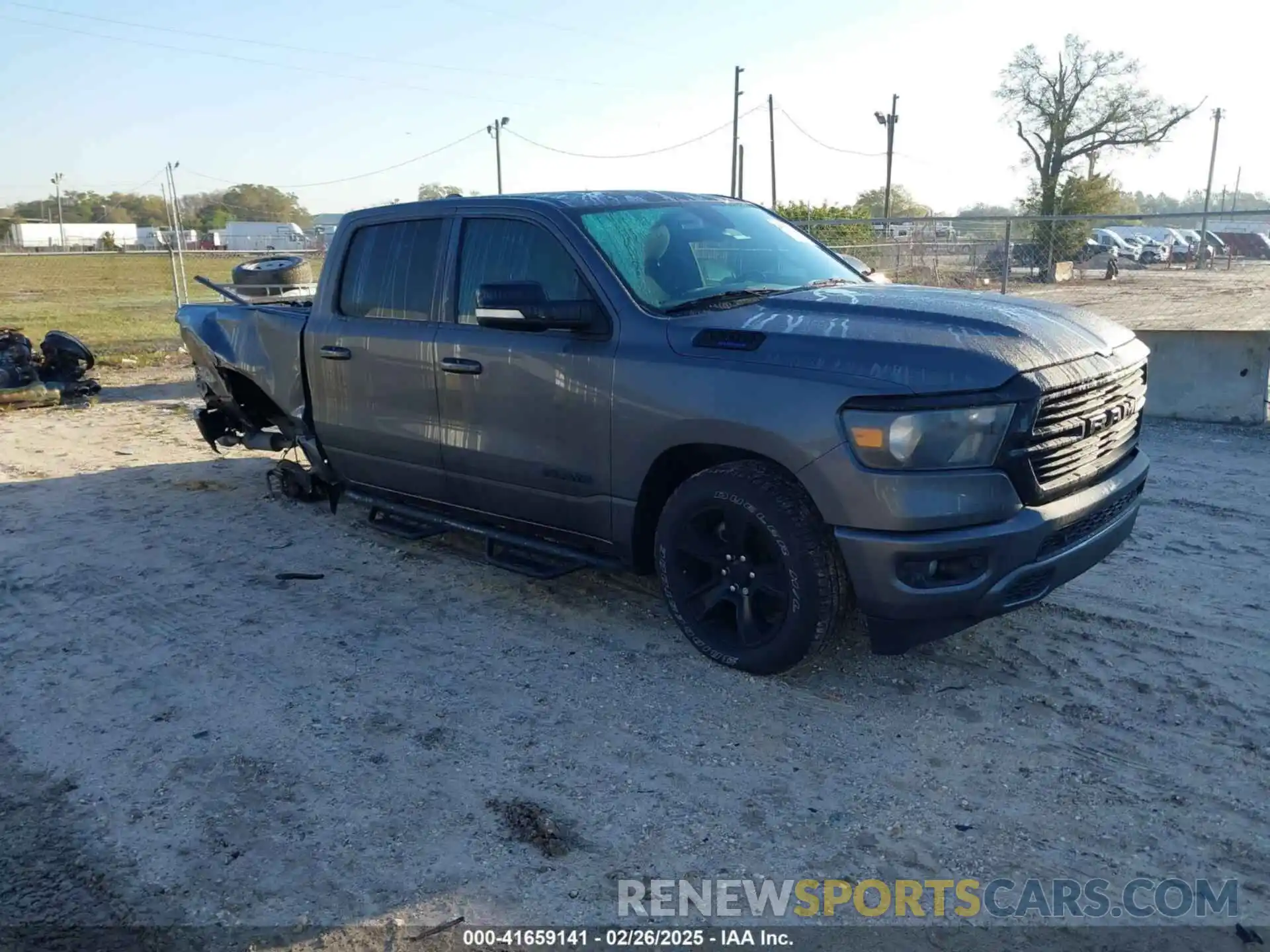 1 Photograph of a damaged car 1C6RREFT0MN629169 RAM 1500 2021