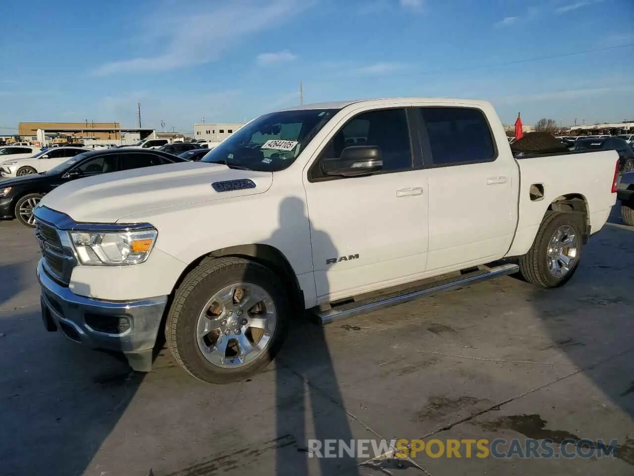 1 Photograph of a damaged car 1C6RREFT0MN661085 RAM 1500 2021
