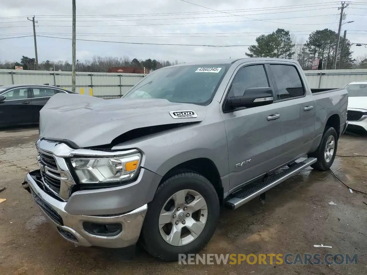 1 Photograph of a damaged car 1C6RREFT1MN801967 RAM 1500 2021