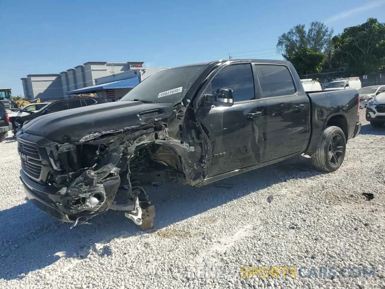 1 Photograph of a damaged car 1C6RREFT2MN660620 RAM 1500 2021