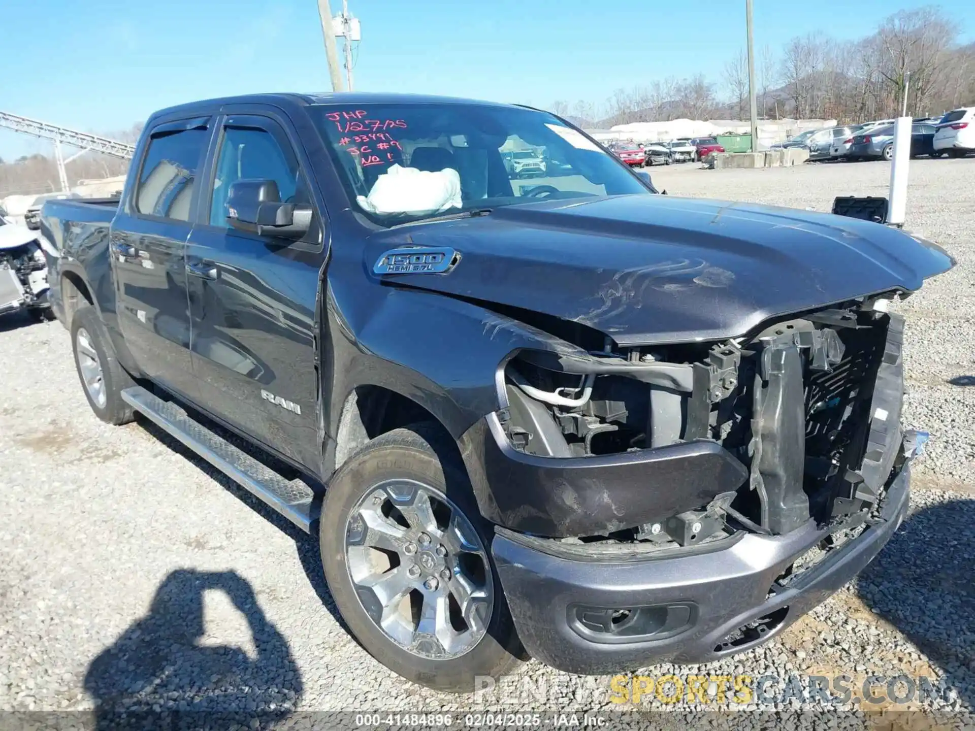 1 Photograph of a damaged car 1C6RREFT2MN691074 RAM 1500 2021