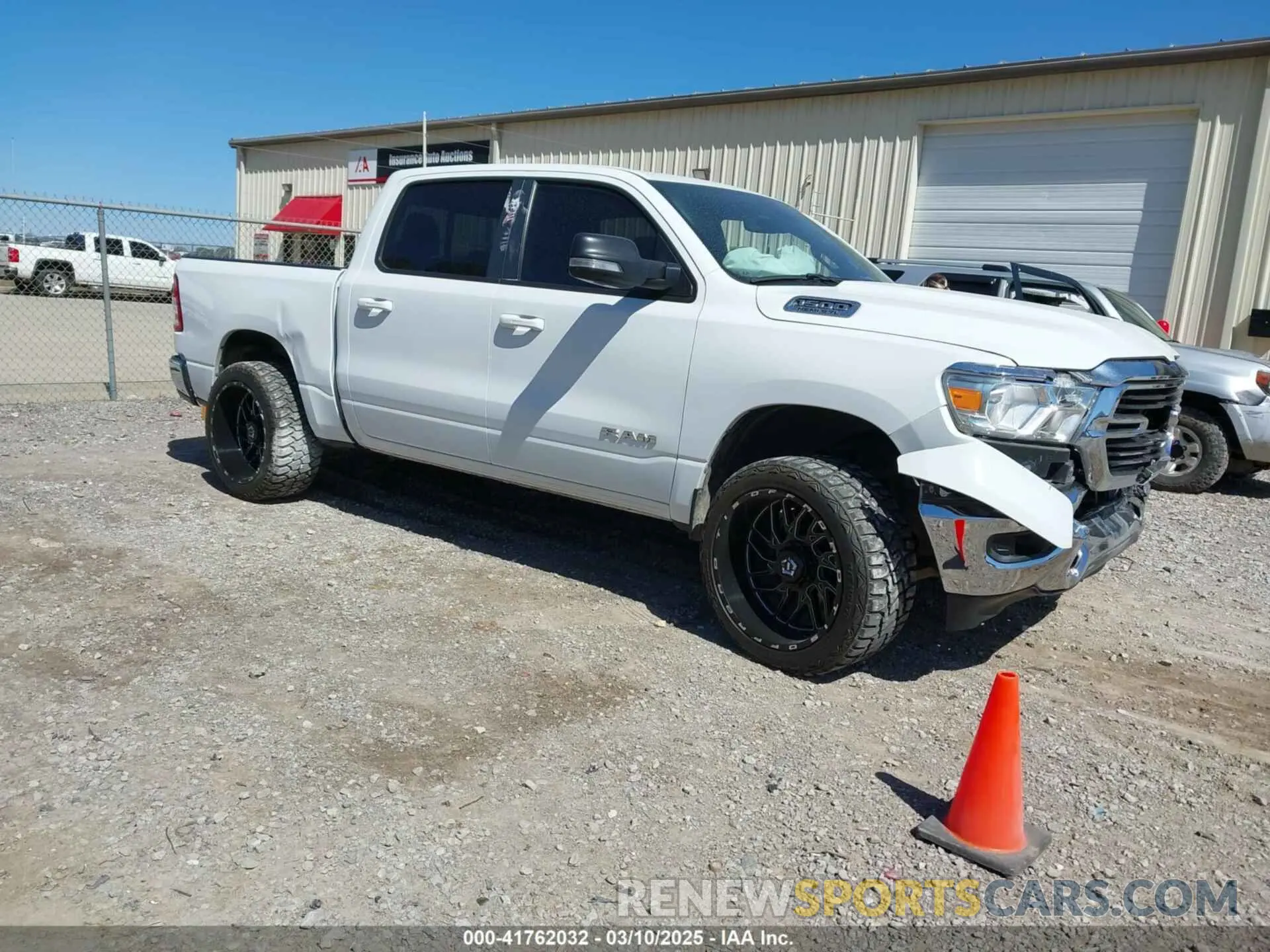 1 Photograph of a damaged car 1C6RREFT4MN708750 RAM 1500 2021