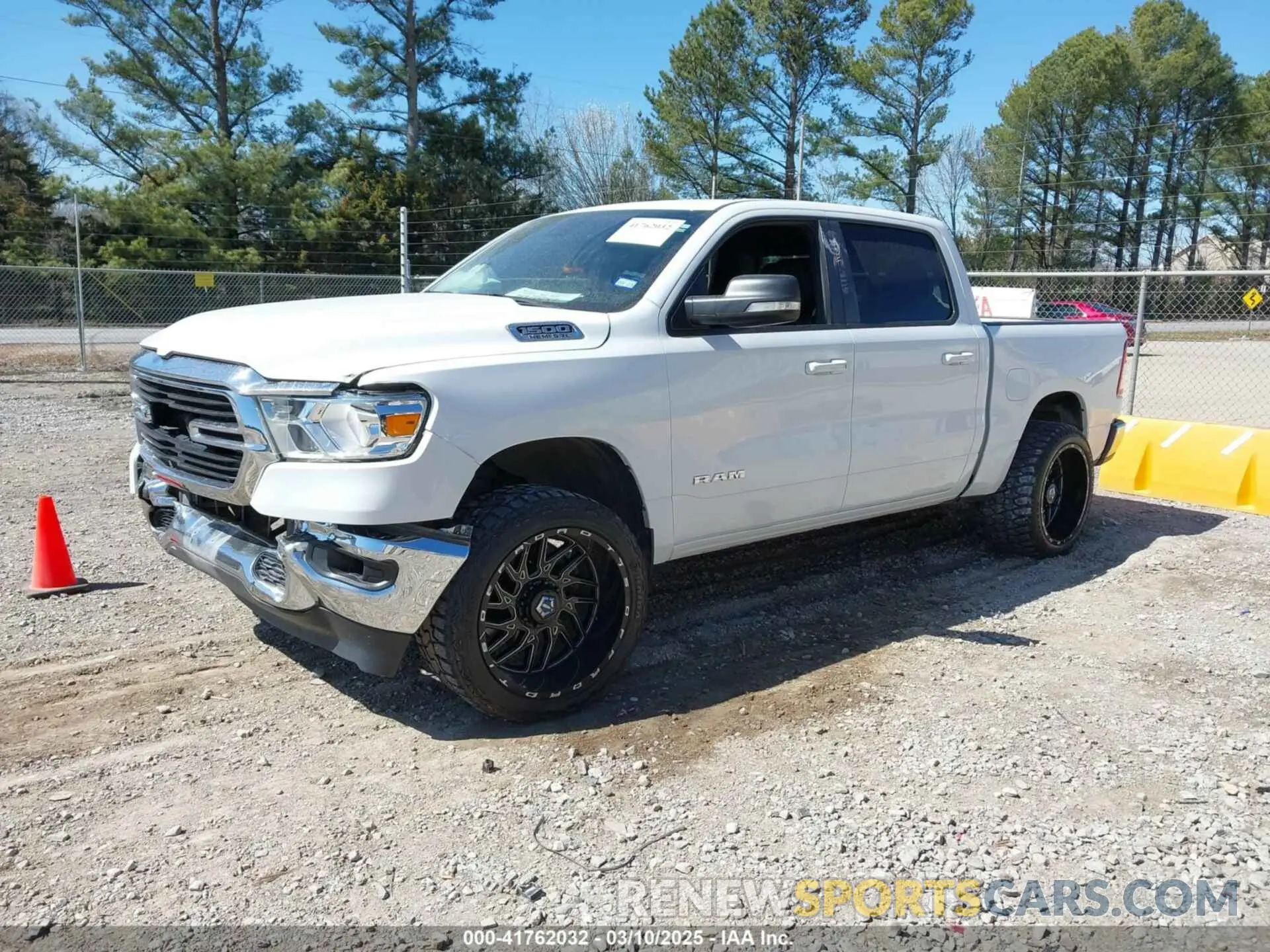 2 Photograph of a damaged car 1C6RREFT4MN708750 RAM 1500 2021