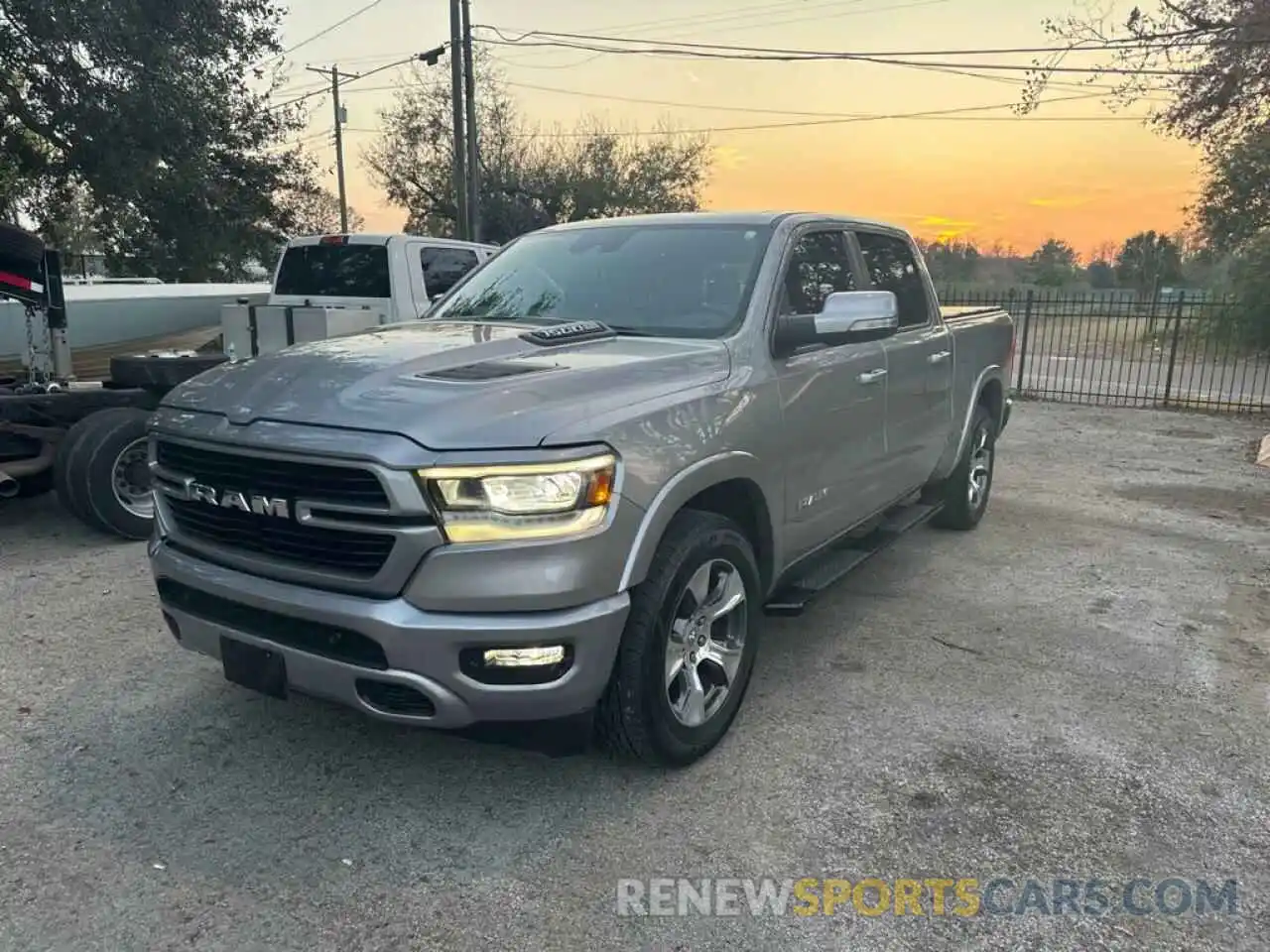 1 Photograph of a damaged car 1C6RREJT0MN712883 RAM 1500 2021