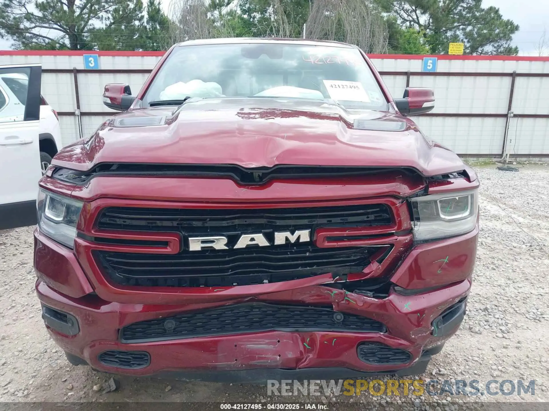 12 Photograph of a damaged car 1C6RREJT1MN767990 RAM 1500 2021