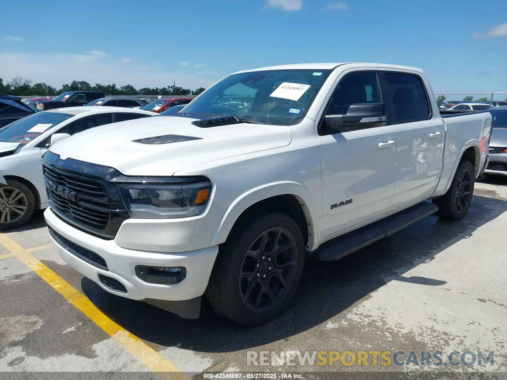 2 Photograph of a damaged car 1C6RREJTXMN704600 RAM 1500 2021