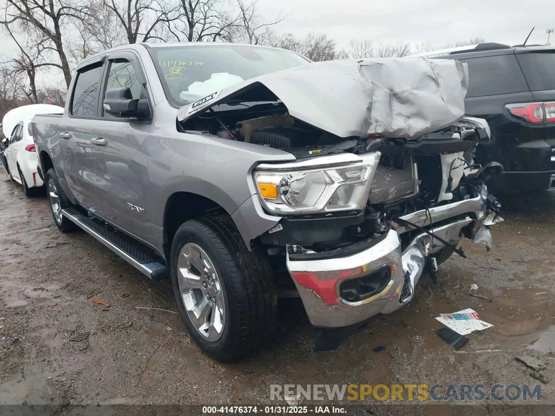 1 Photograph of a damaged car 1C6RRFFG8MN723311 RAM 1500 2021