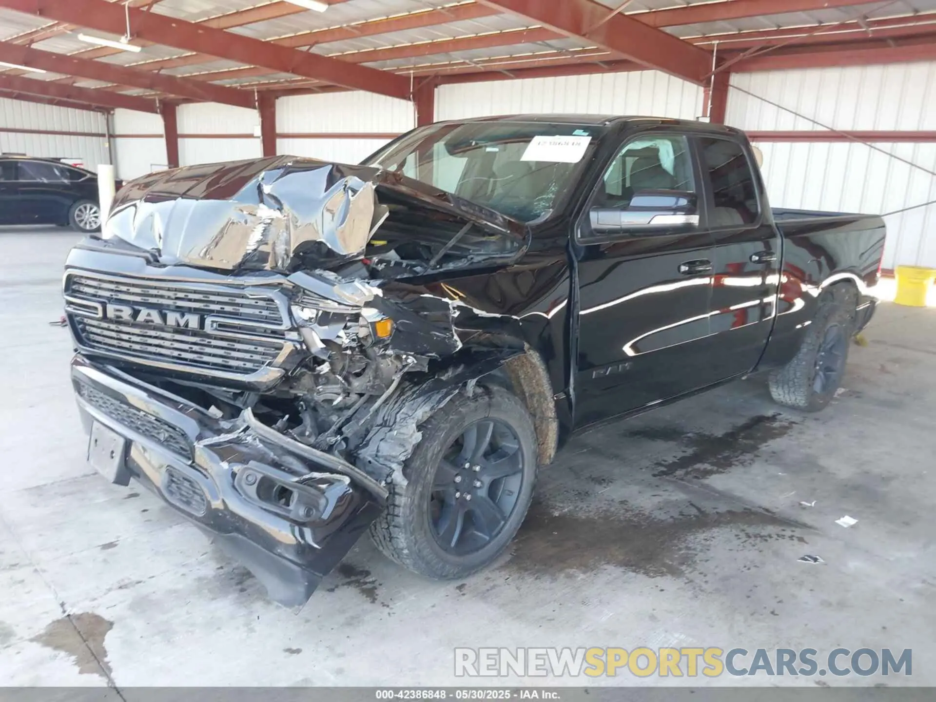 2 Photograph of a damaged car 1C6SRFBT2MN562927 RAM 1500 2021