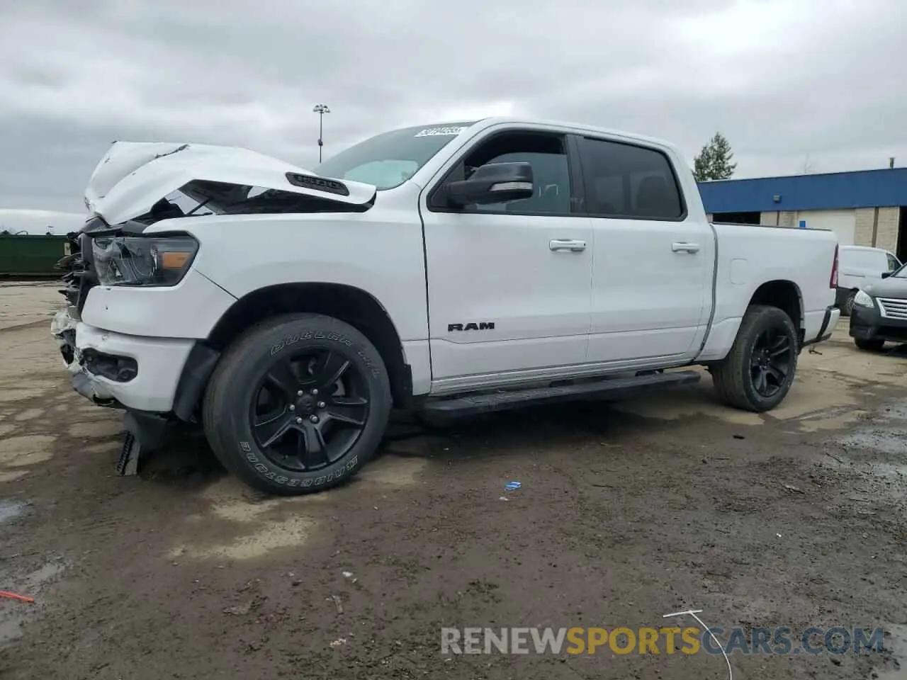 1 Photograph of a damaged car 1C6SRFFT0MN508939 RAM 1500 2021