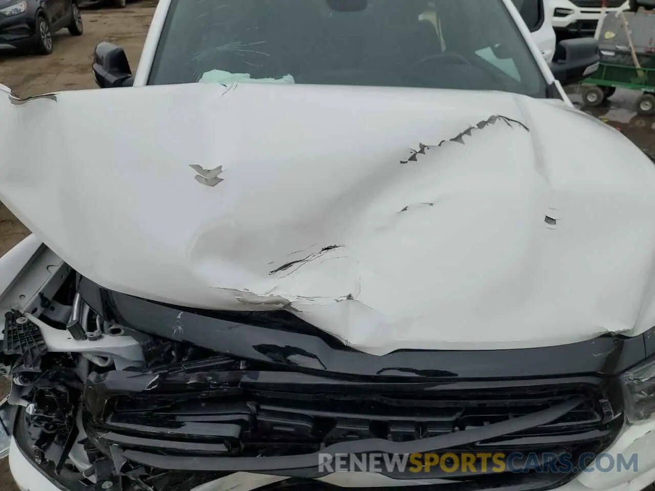 12 Photograph of a damaged car 1C6SRFFT0MN508939 RAM 1500 2021