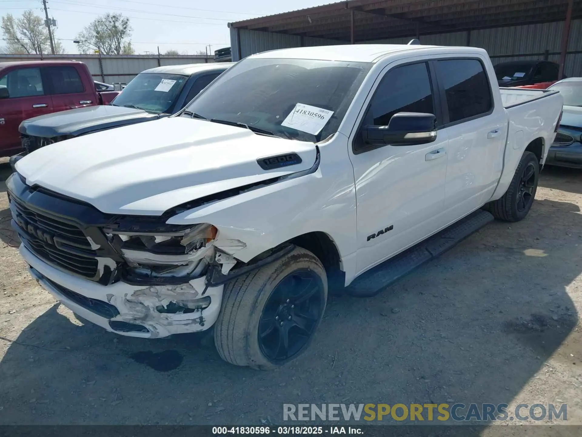2 Photograph of a damaged car 1C6SRFFT0MN521027 RAM 1500 2021