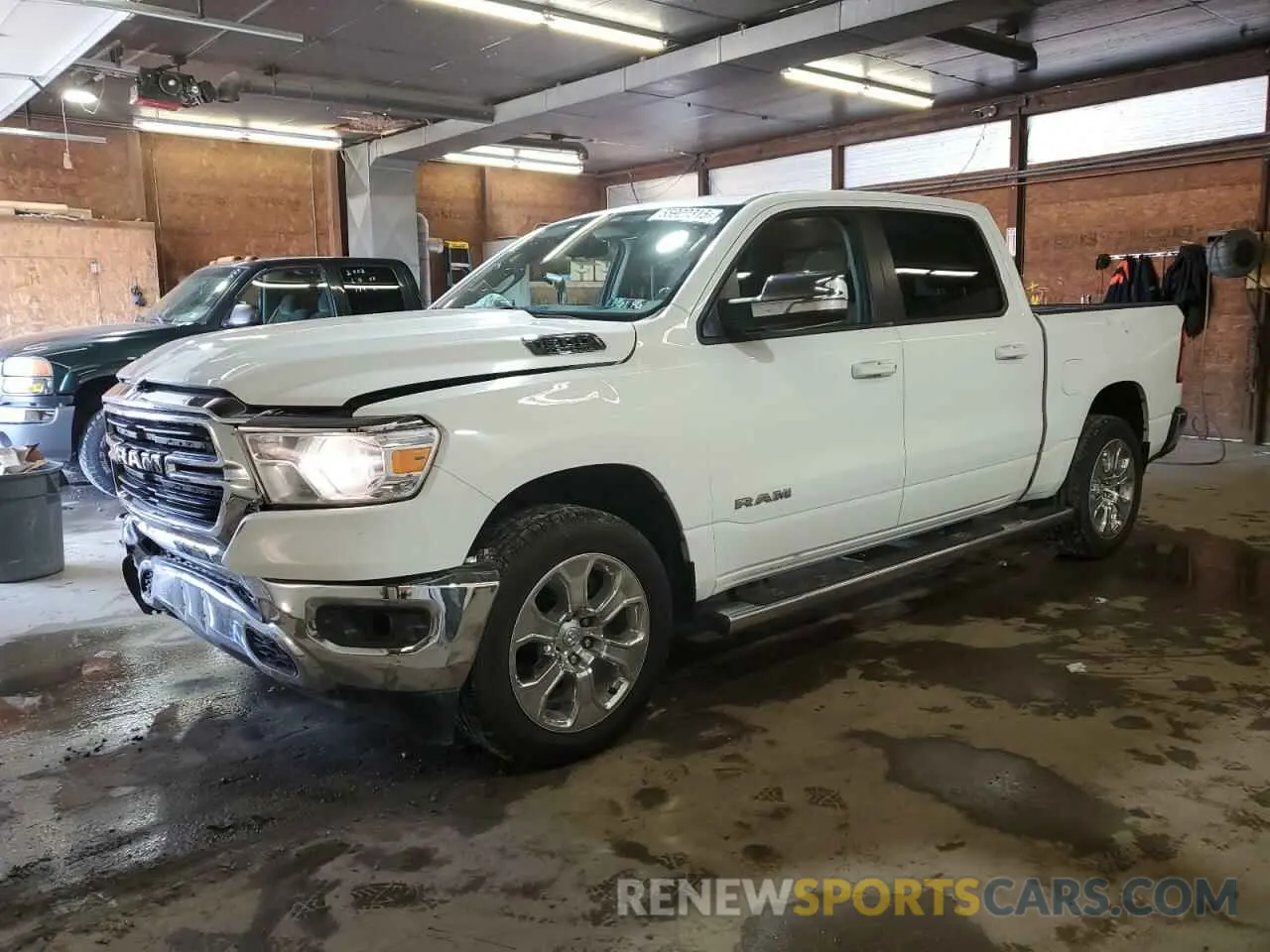 1 Photograph of a damaged car 1C6SRFFT0MN662146 RAM 1500 2021