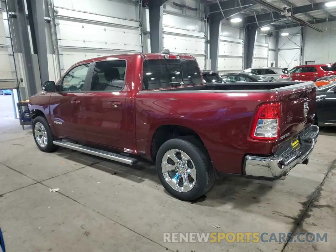 2 Photograph of a damaged car 1C6SRFFT0MN723639 RAM 1500 2021