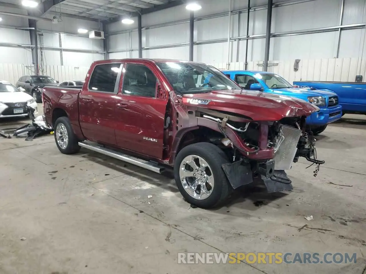 4 Photograph of a damaged car 1C6SRFFT0MN723639 RAM 1500 2021