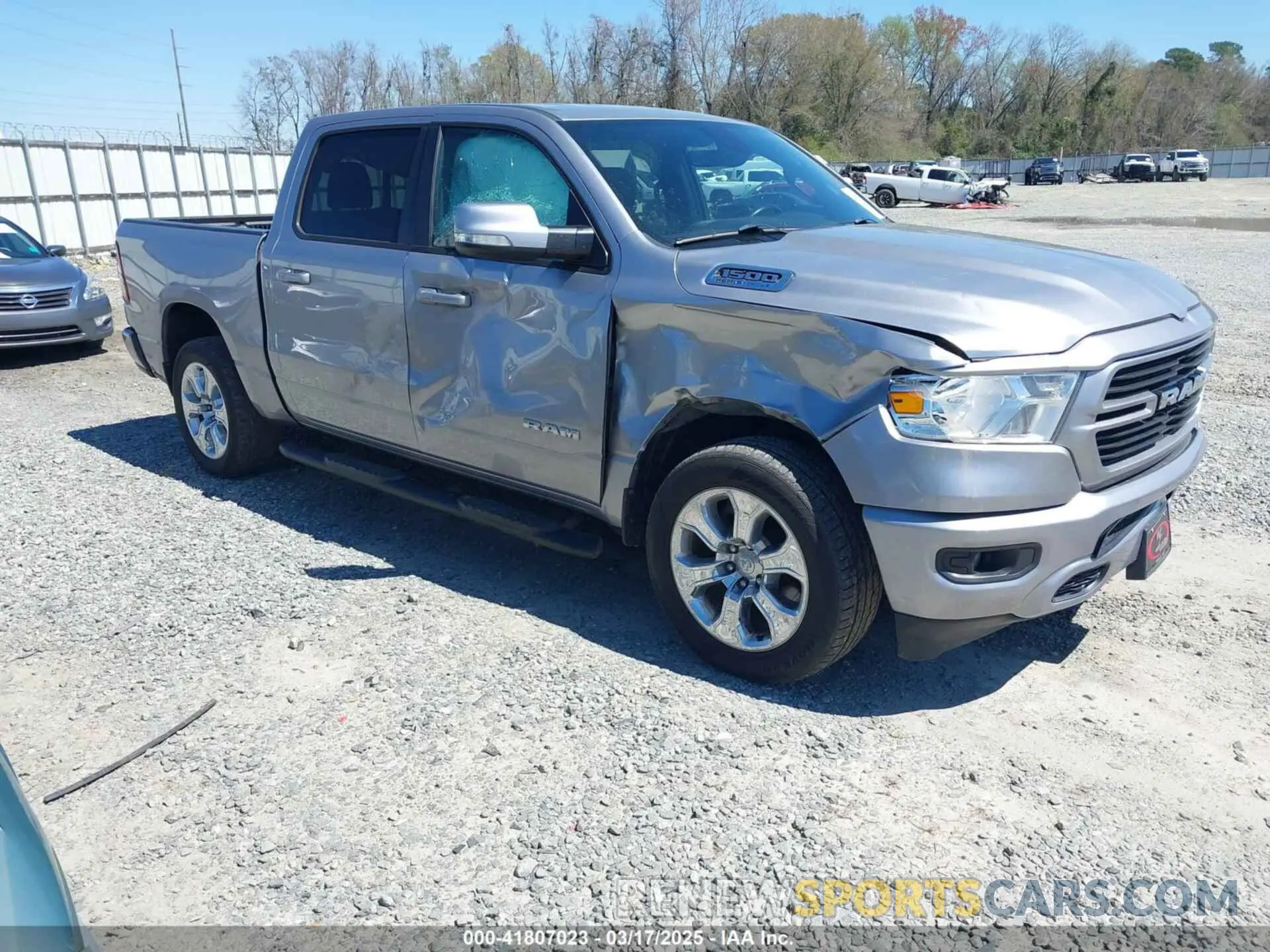 1 Photograph of a damaged car 1C6SRFFT0MN758262 RAM 1500 2021