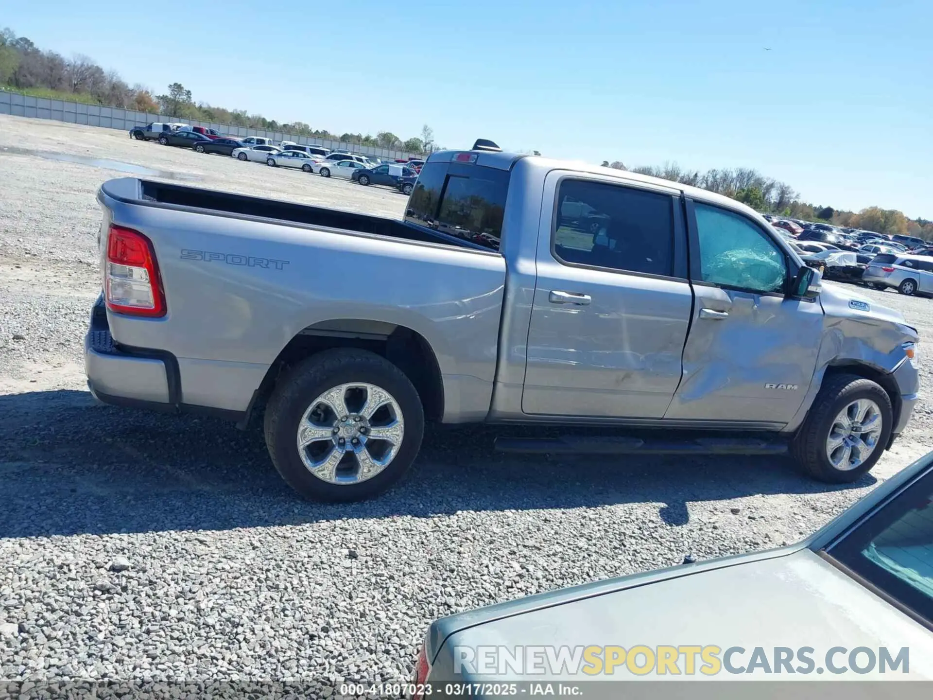 13 Photograph of a damaged car 1C6SRFFT0MN758262 RAM 1500 2021