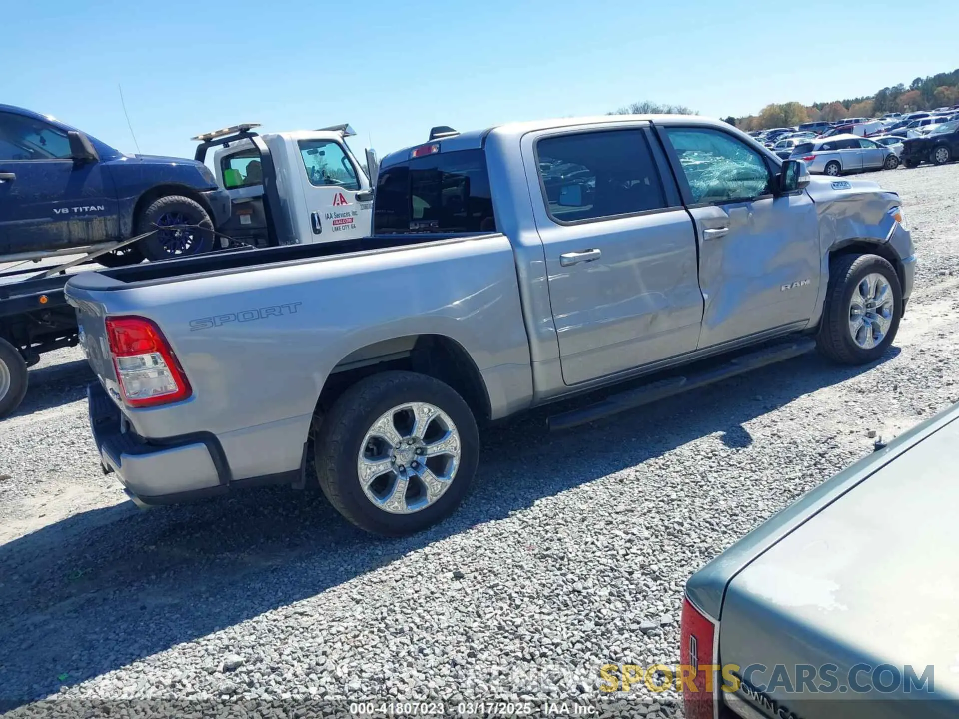 4 Photograph of a damaged car 1C6SRFFT0MN758262 RAM 1500 2021