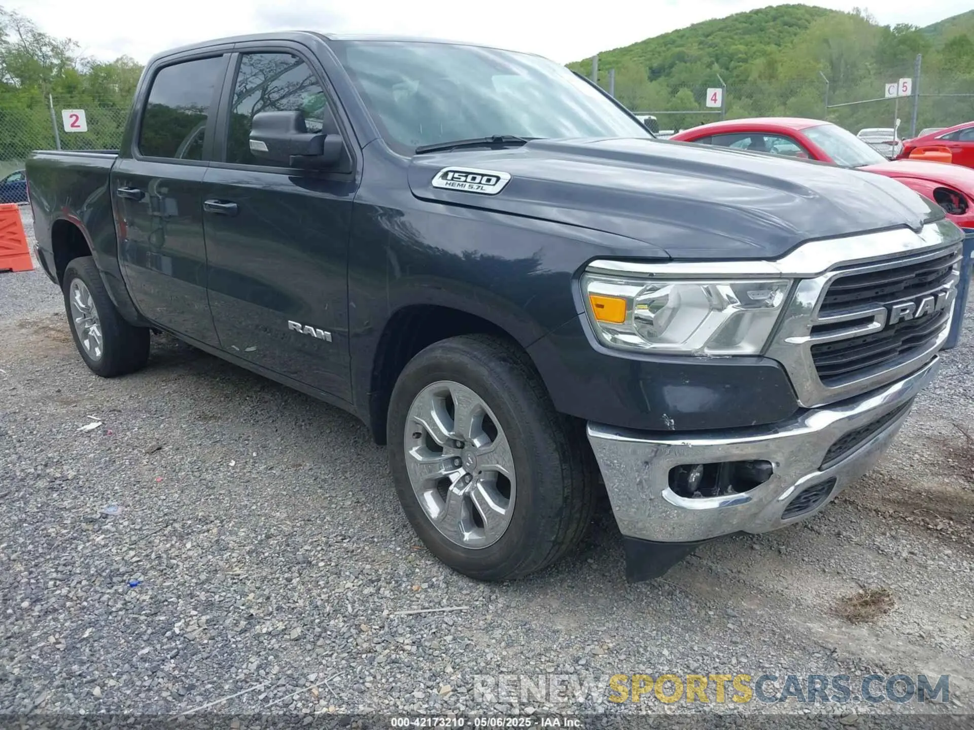 1 Photograph of a damaged car 1C6SRFFT1MN647851 RAM 1500 2021