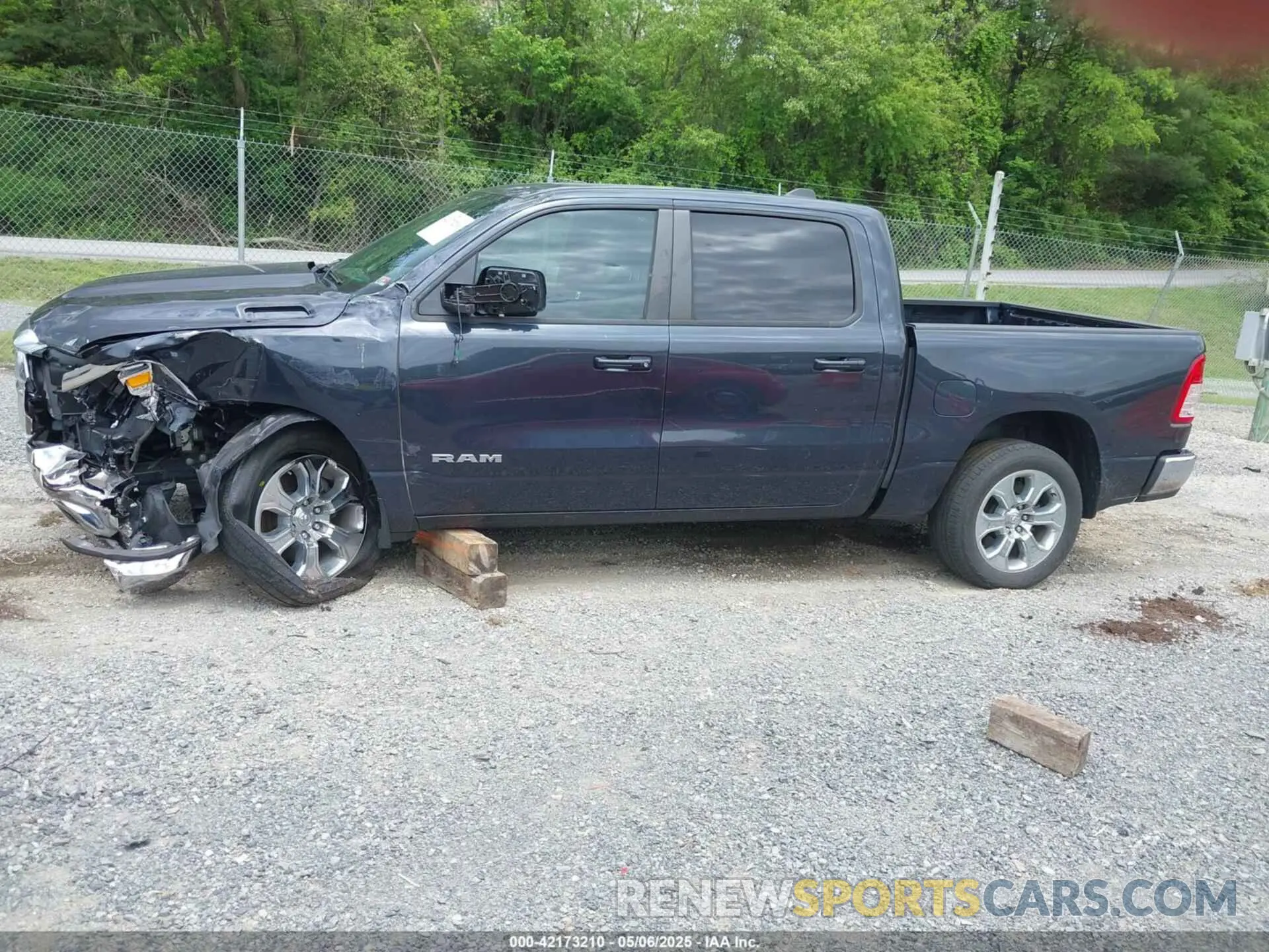 14 Photograph of a damaged car 1C6SRFFT1MN647851 RAM 1500 2021