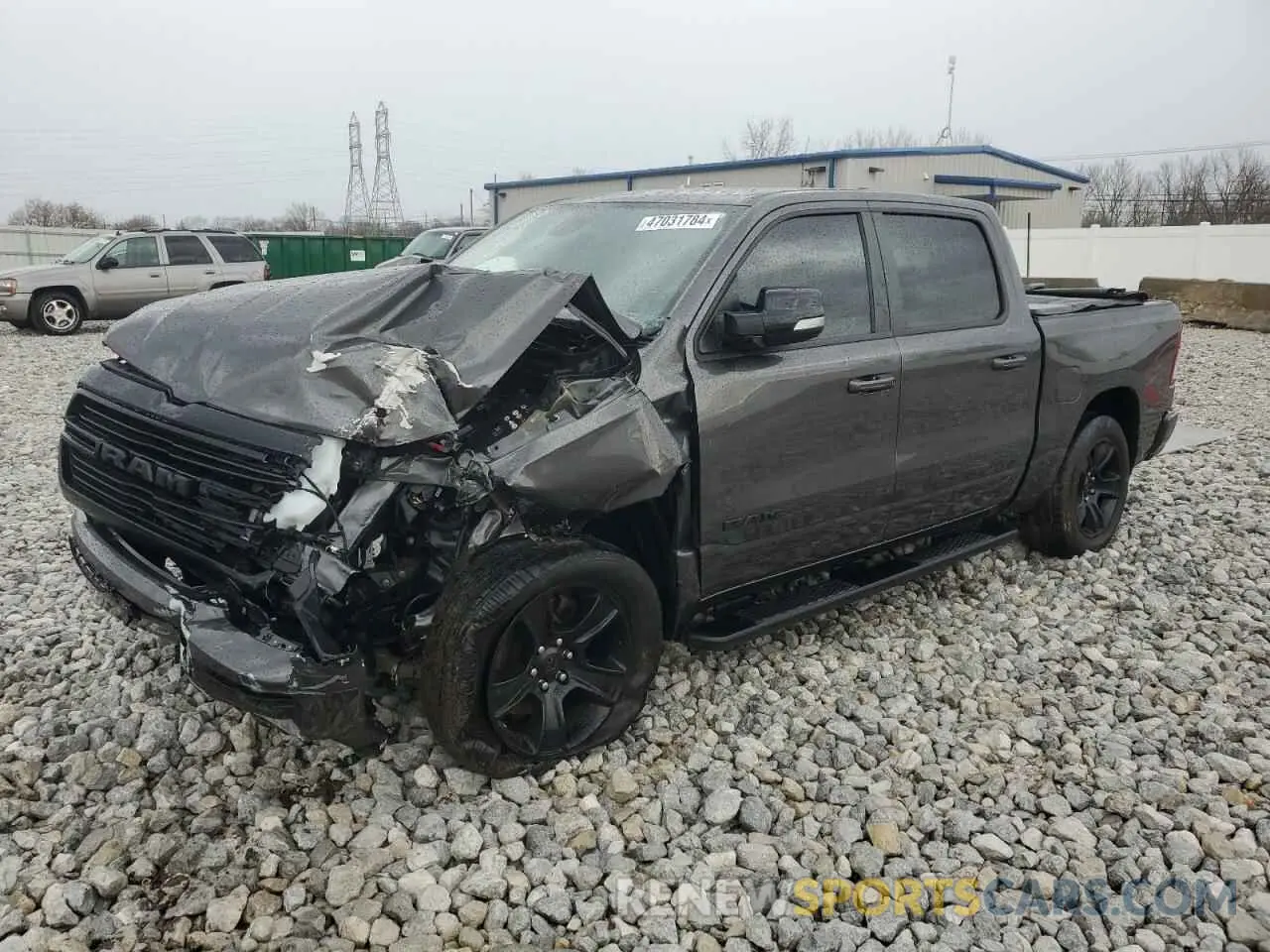 1 Photograph of a damaged car 1C6SRFFT1MN673978 RAM 1500 2021