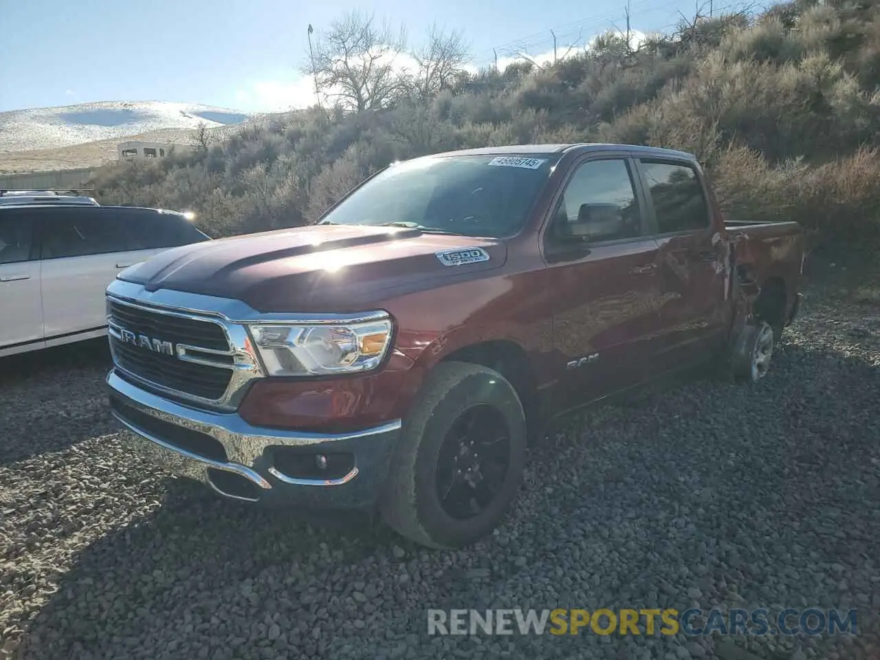 1 Photograph of a damaged car 1C6SRFFT1MN729921 RAM 1500 2021
