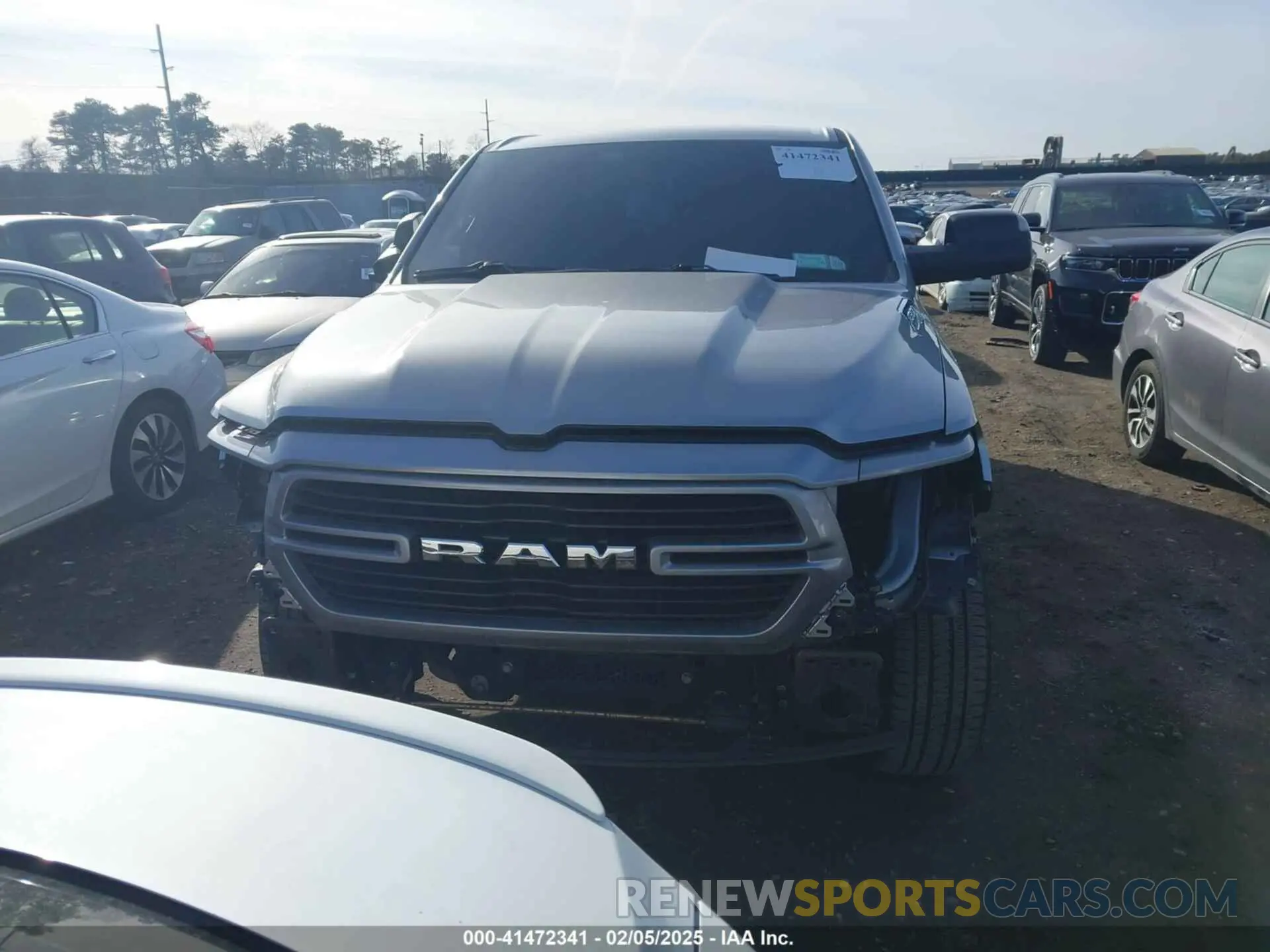 12 Photograph of a damaged car 1C6SRFFT1MN795398 RAM 1500 2021