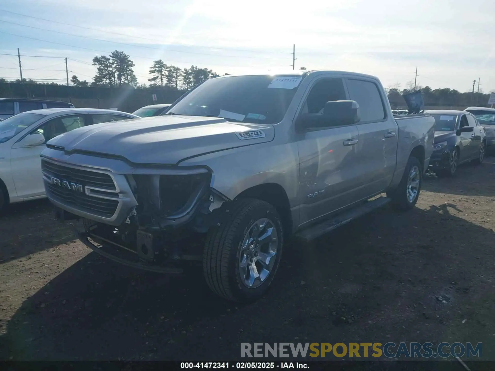 2 Photograph of a damaged car 1C6SRFFT1MN795398 RAM 1500 2021