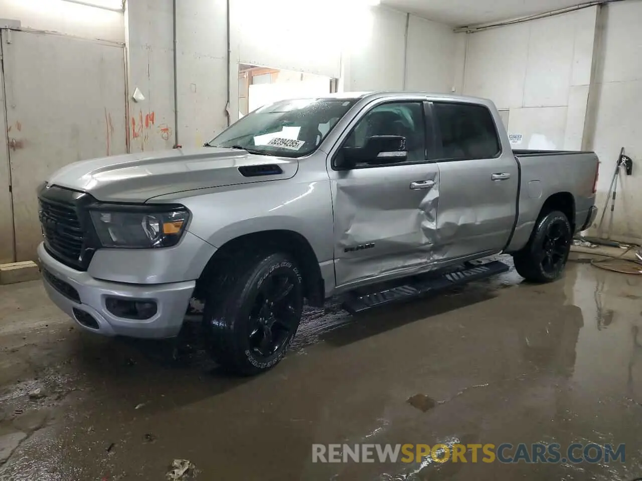 1 Photograph of a damaged car 1C6SRFFT2MN598580 RAM 1500 2021