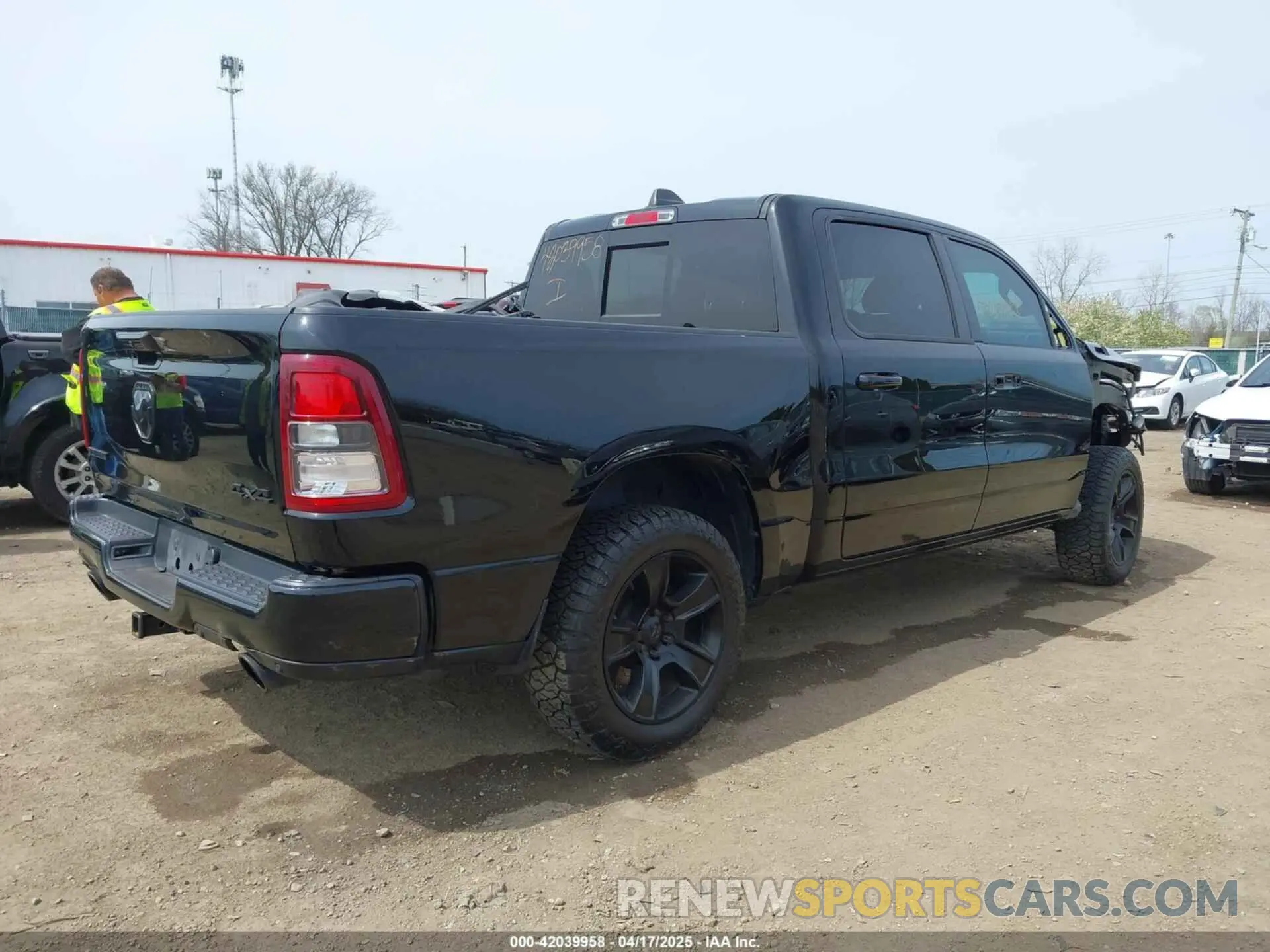 4 Photograph of a damaged car 1C6SRFFT2MN601851 RAM 1500 2021