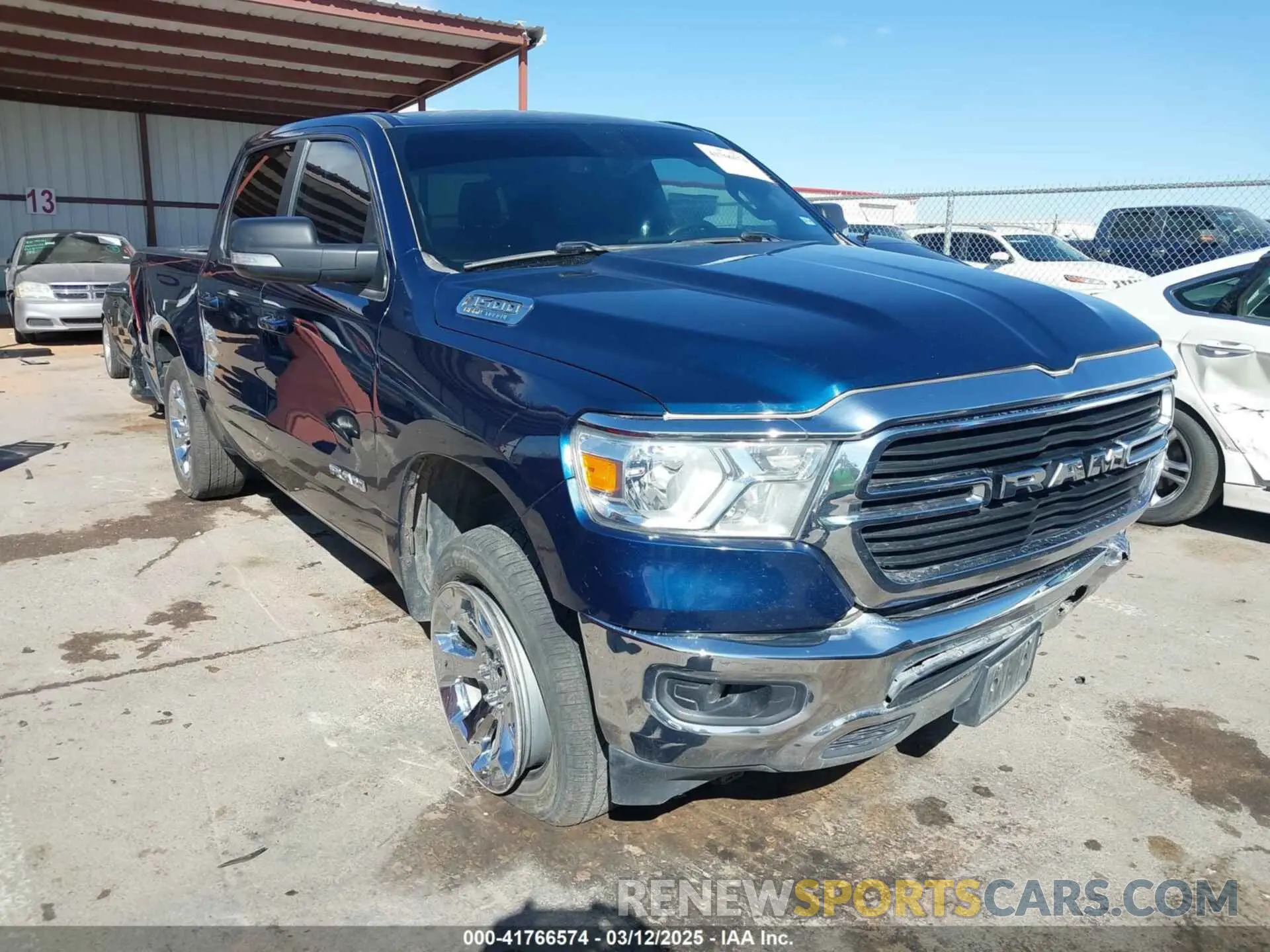 1 Photograph of a damaged car 1C6SRFFT2MN634705 RAM 1500 2021