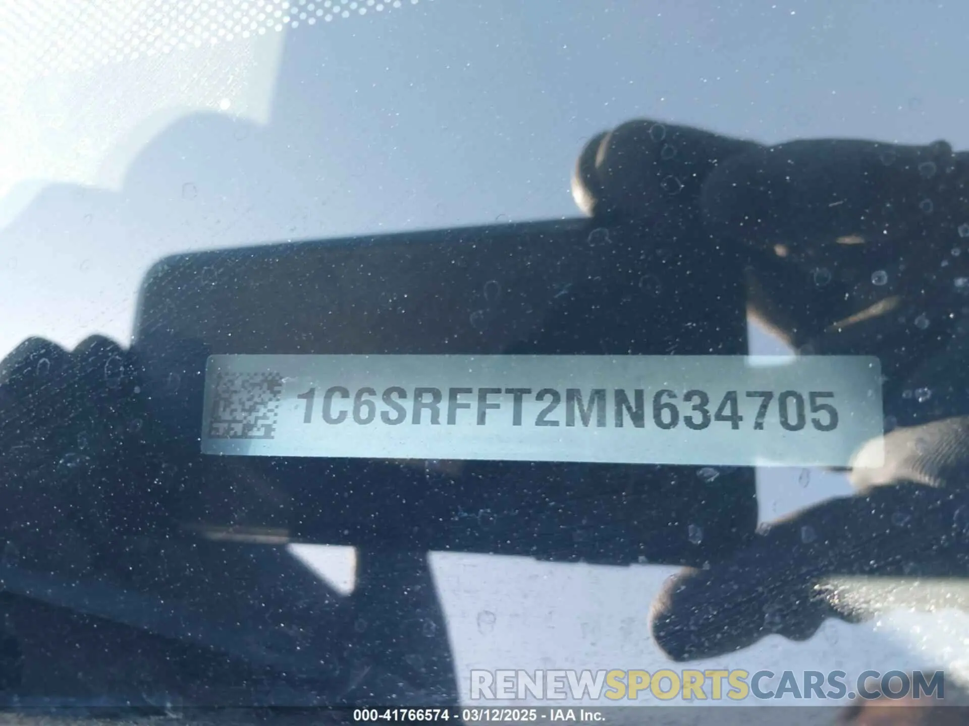 9 Photograph of a damaged car 1C6SRFFT2MN634705 RAM 1500 2021