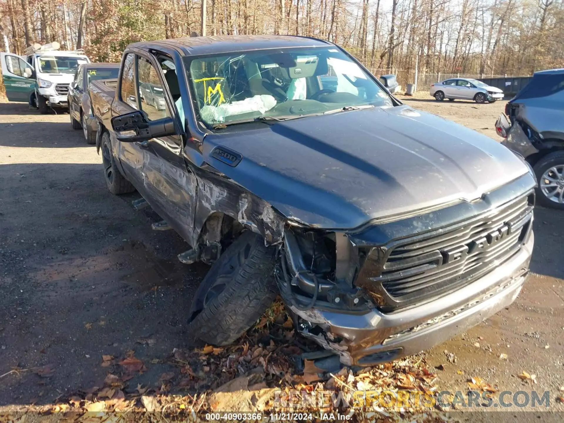 1 Photograph of a damaged car 1C6SRFFT3MN576023 RAM 1500 2021