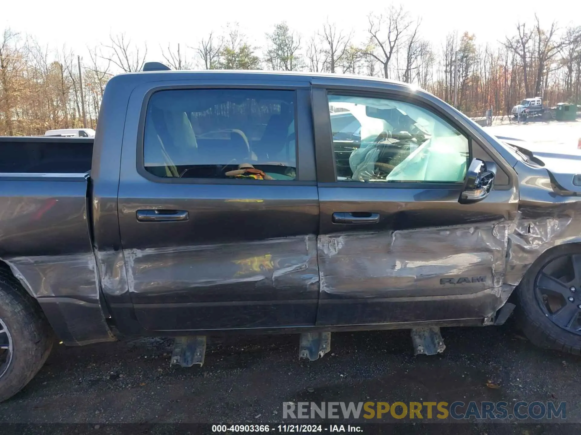 13 Photograph of a damaged car 1C6SRFFT3MN576023 RAM 1500 2021