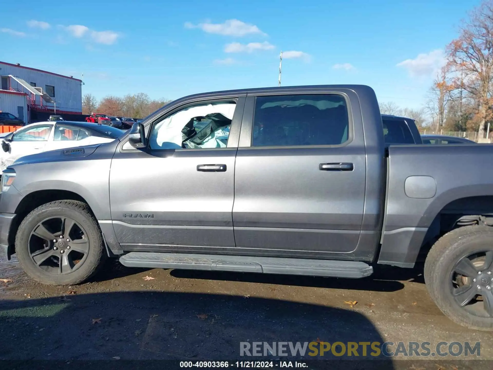 14 Photograph of a damaged car 1C6SRFFT3MN576023 RAM 1500 2021