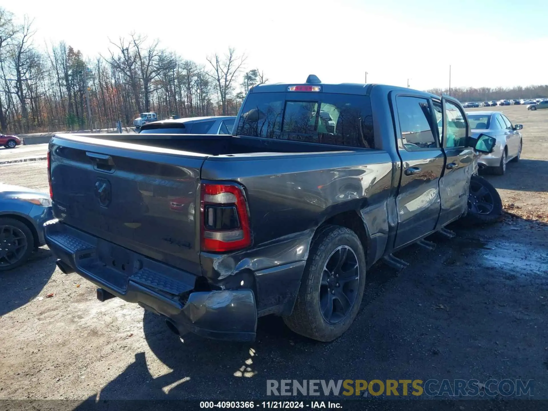 4 Photograph of a damaged car 1C6SRFFT3MN576023 RAM 1500 2021