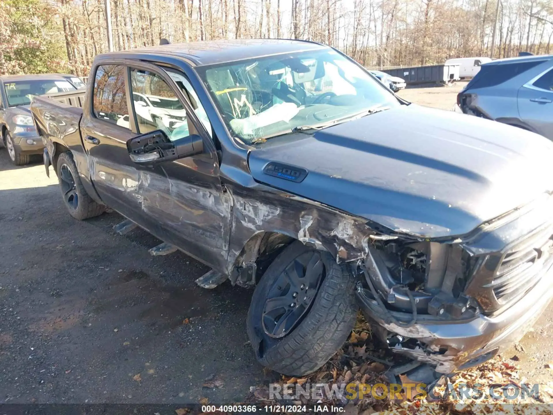 6 Photograph of a damaged car 1C6SRFFT3MN576023 RAM 1500 2021