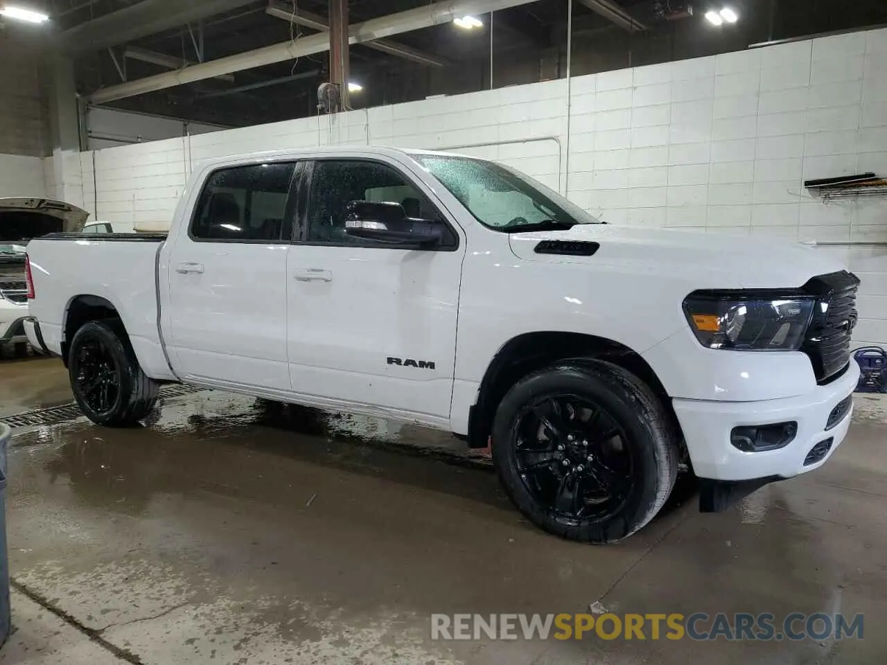 4 Photograph of a damaged car 1C6SRFFT3MN675148 RAM 1500 2021