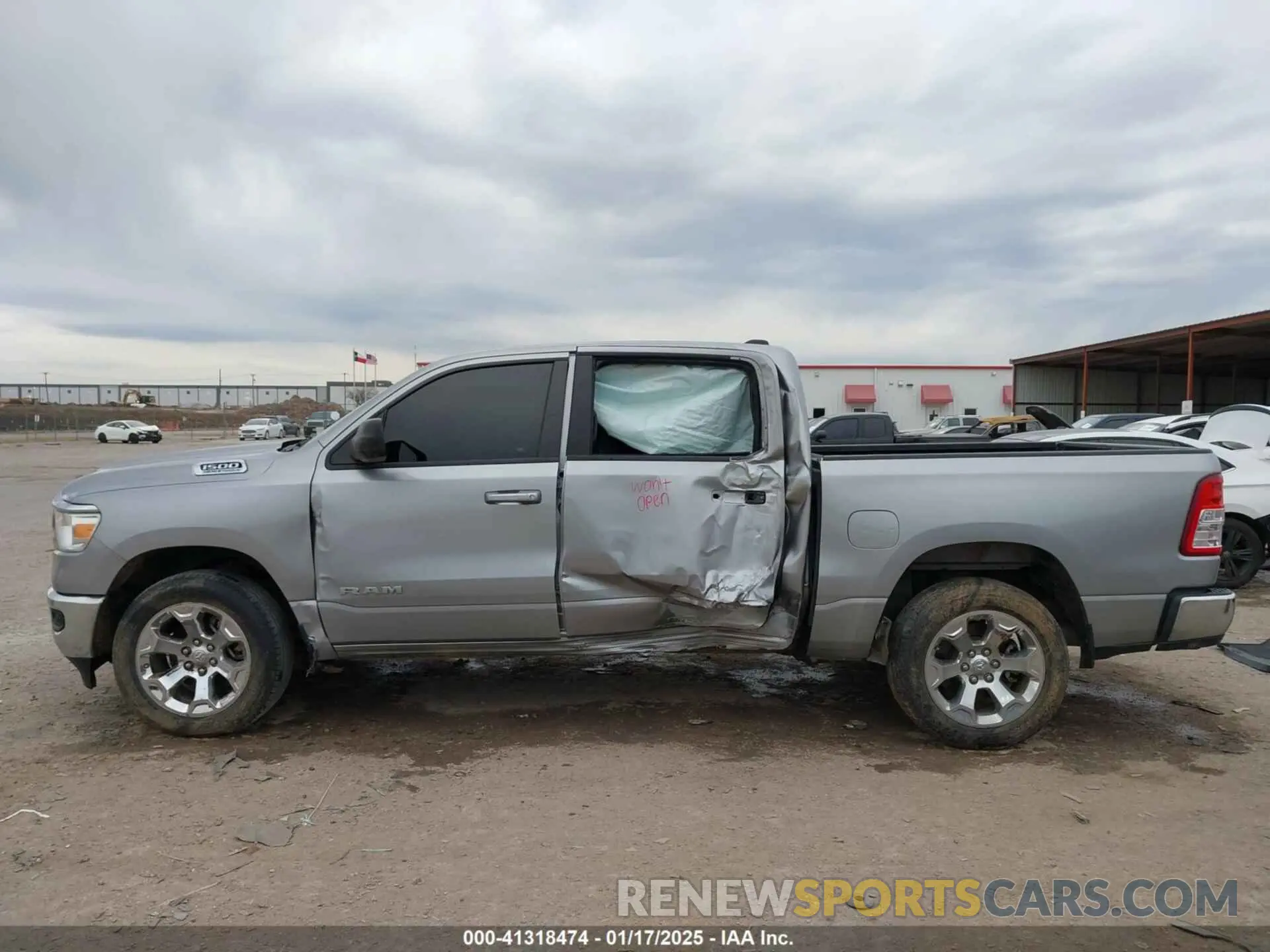 14 Photograph of a damaged car 1C6SRFFT3MN796441 RAM 1500 2021