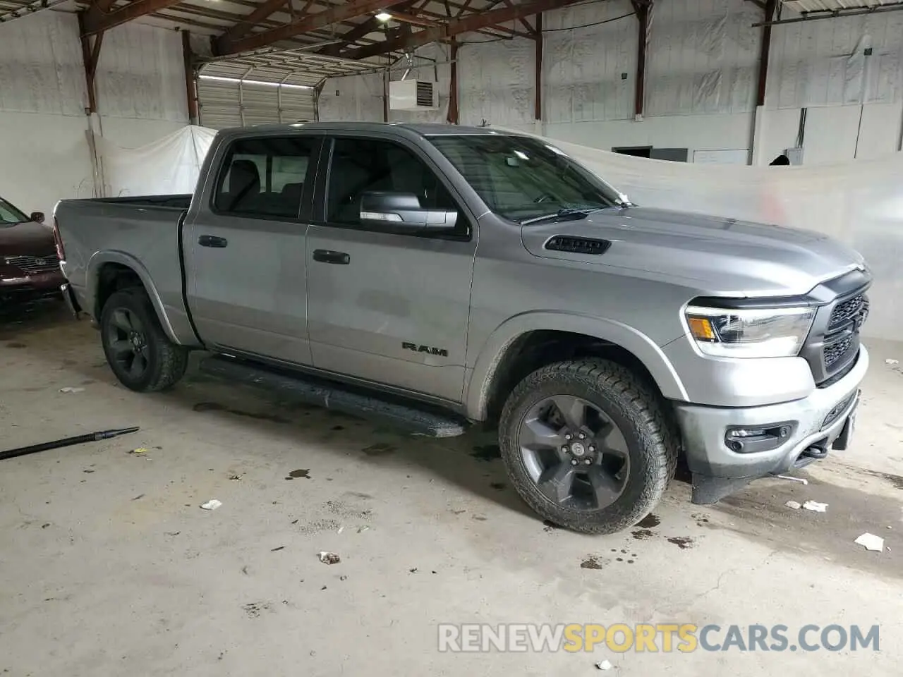 4 Photograph of a damaged car 1C6SRFFT5MN597004 RAM 1500 2021