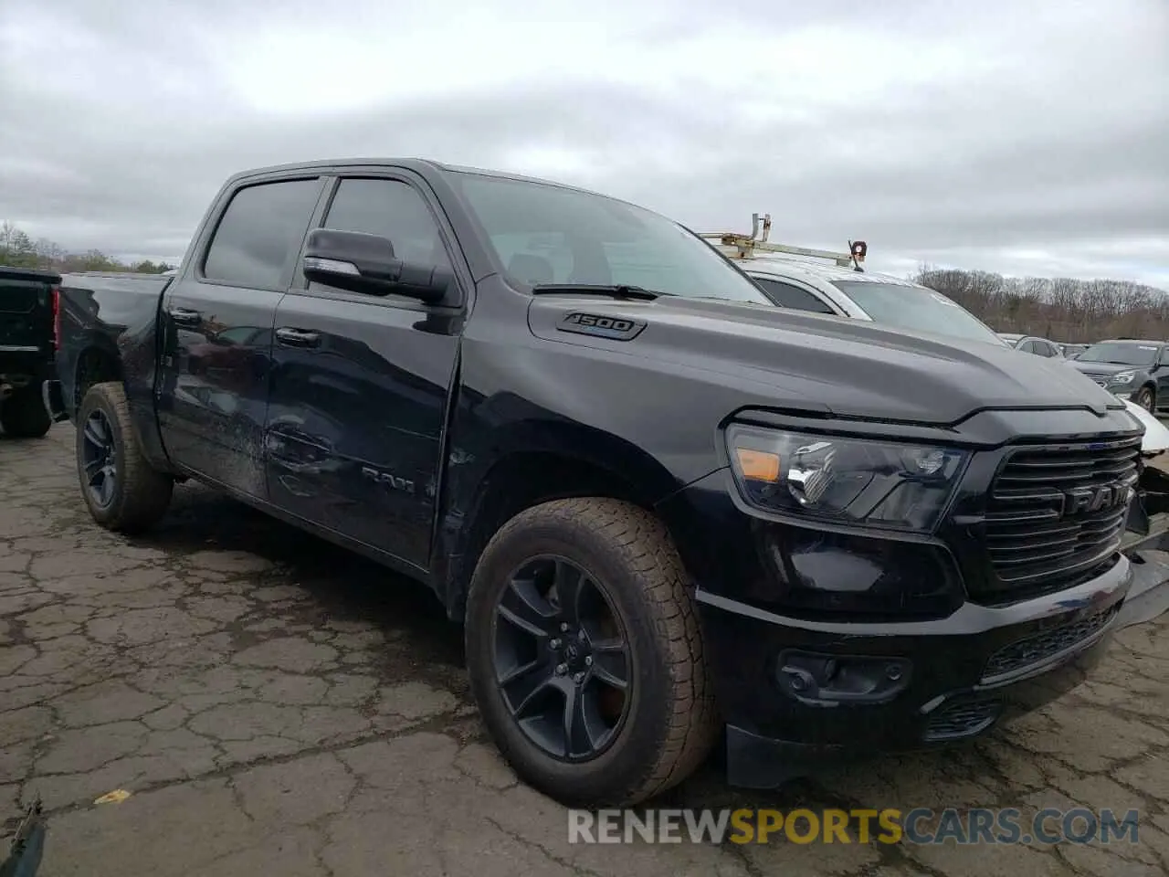 4 Photograph of a damaged car 1C6SRFFT5MN680464 RAM 1500 2021