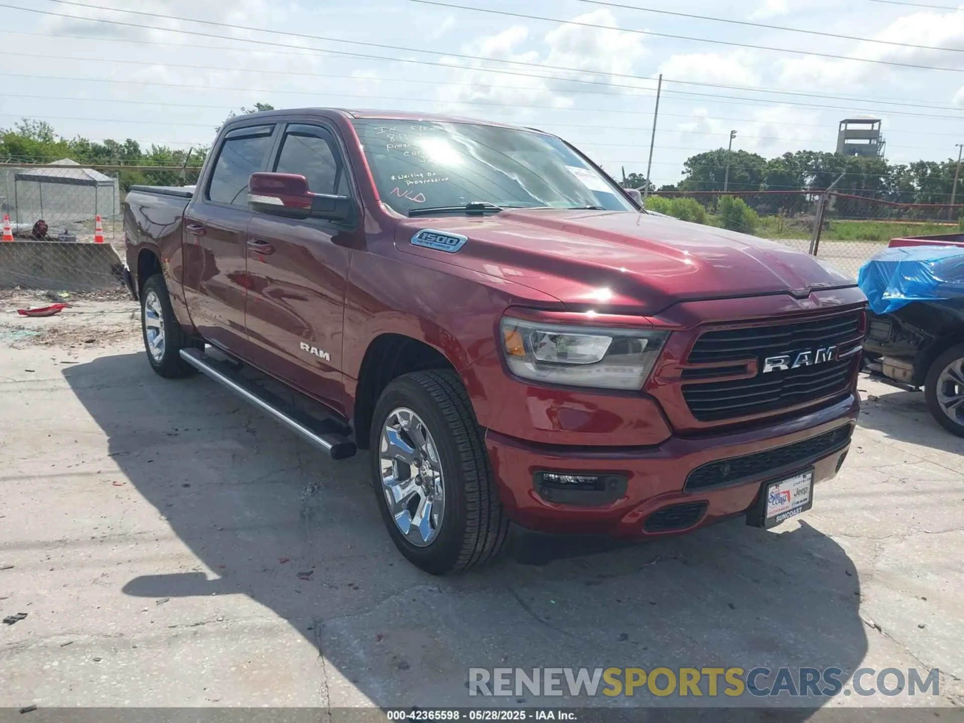 1 Photograph of a damaged car 1C6SRFFT6MN533571 RAM 1500 2021