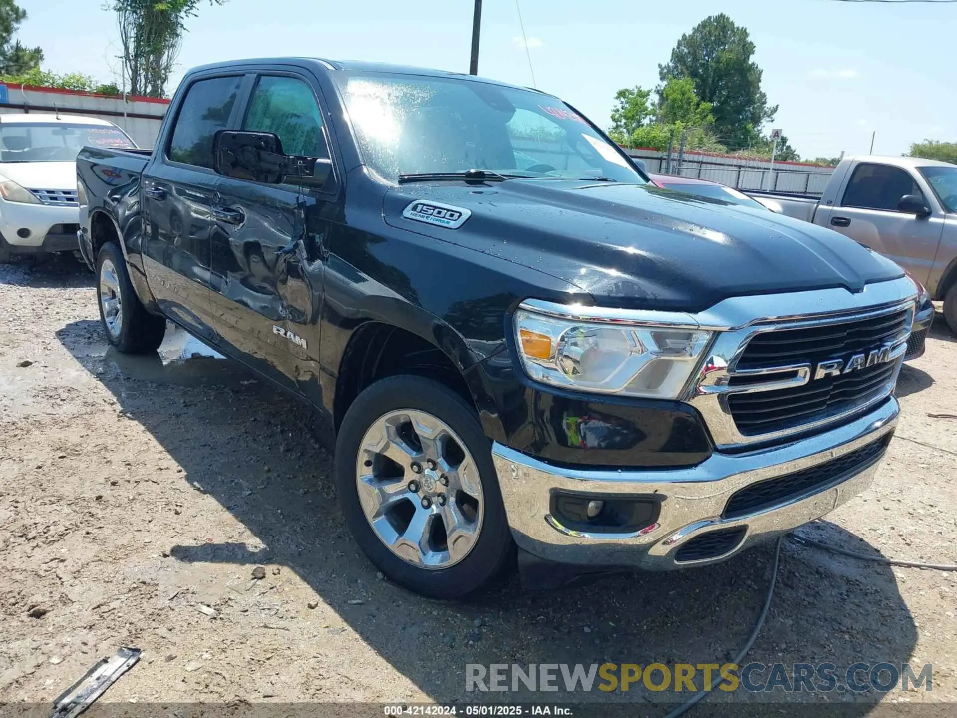 1 Photograph of a damaged car 1C6SRFFT6MN565064 RAM 1500 2021