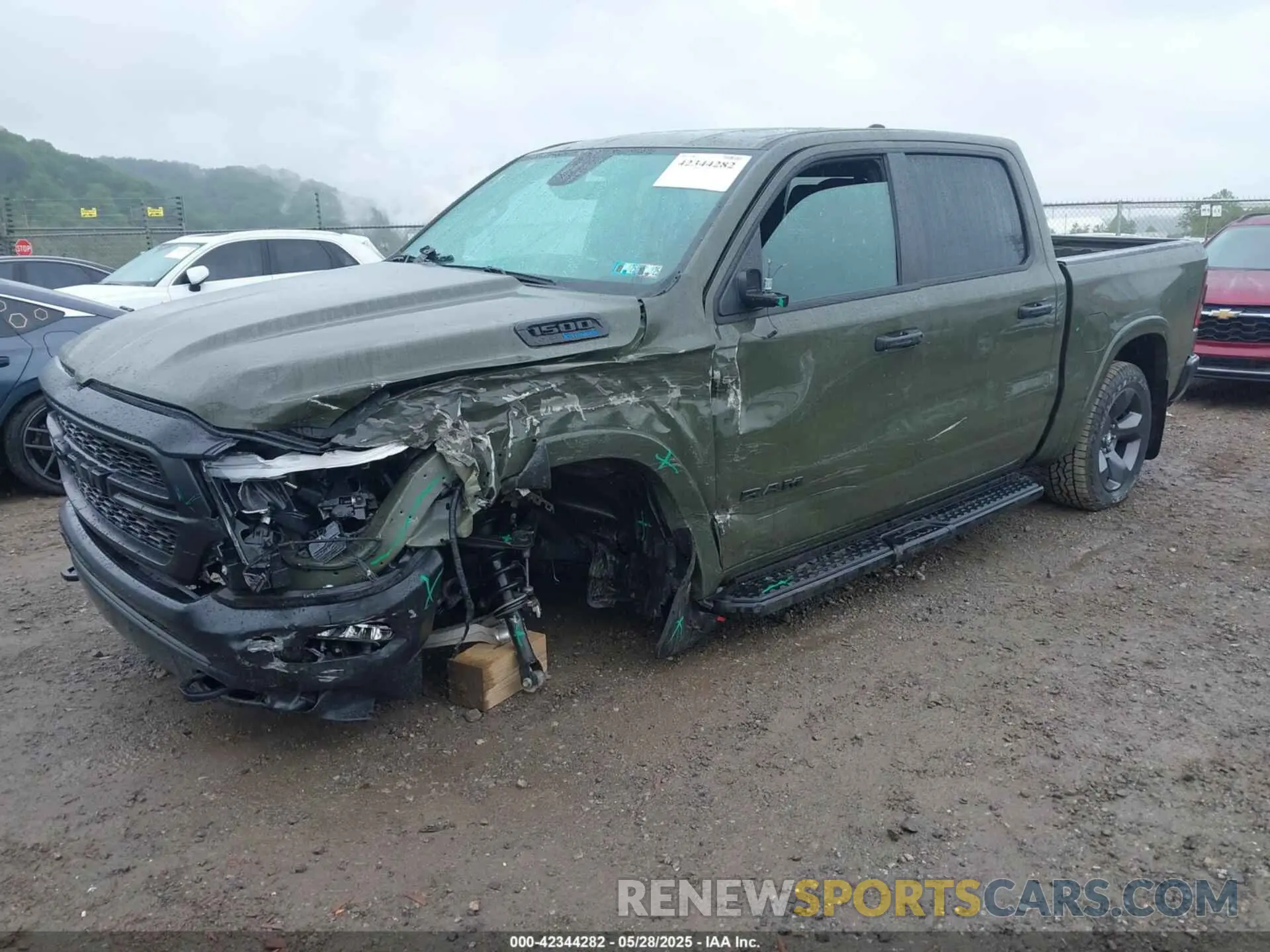 2 Photograph of a damaged car 1C6SRFFT6MN695393 RAM 1500 2021