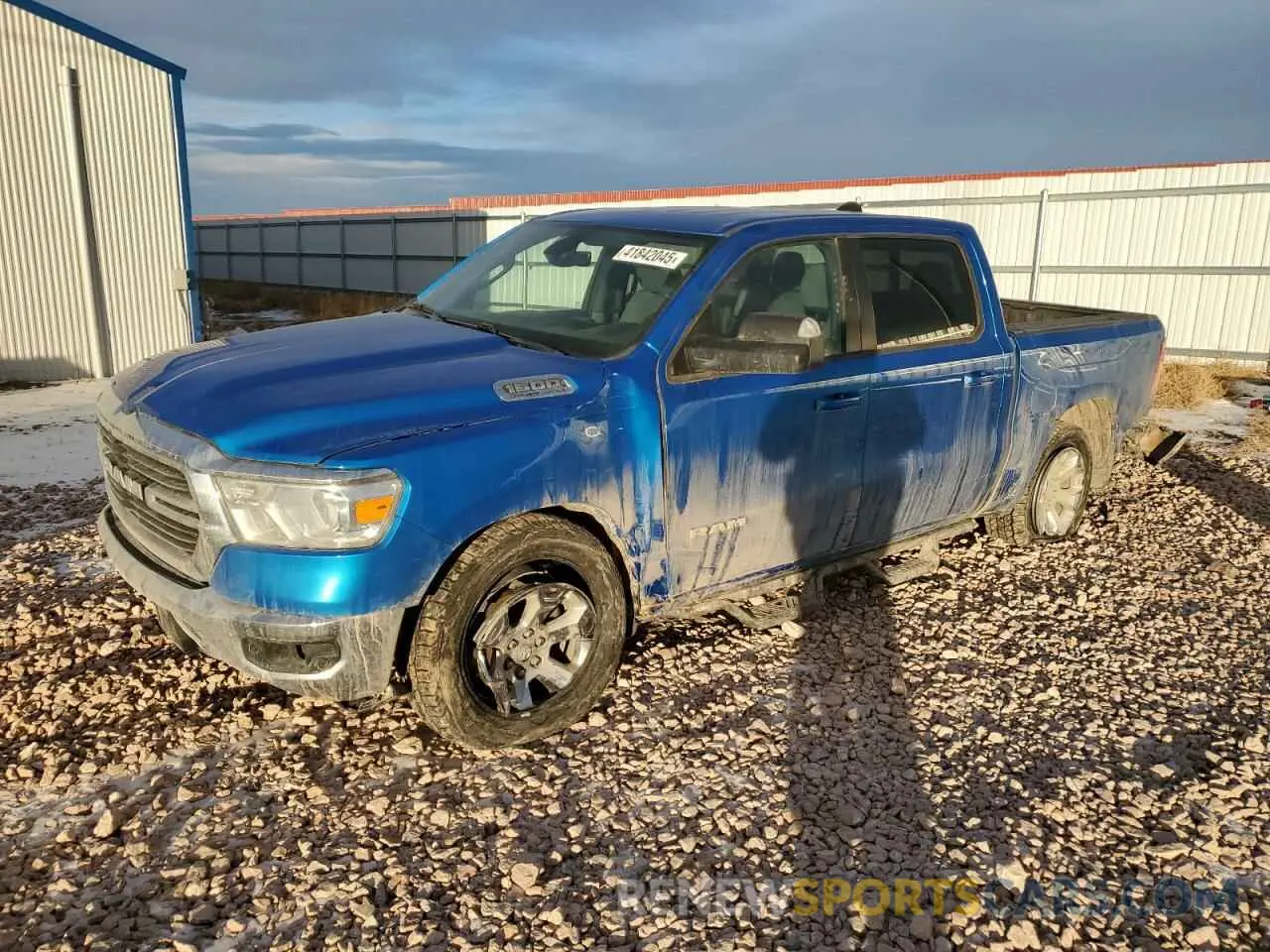 1 Photograph of a damaged car 1C6SRFFT6MN825933 RAM 1500 2021