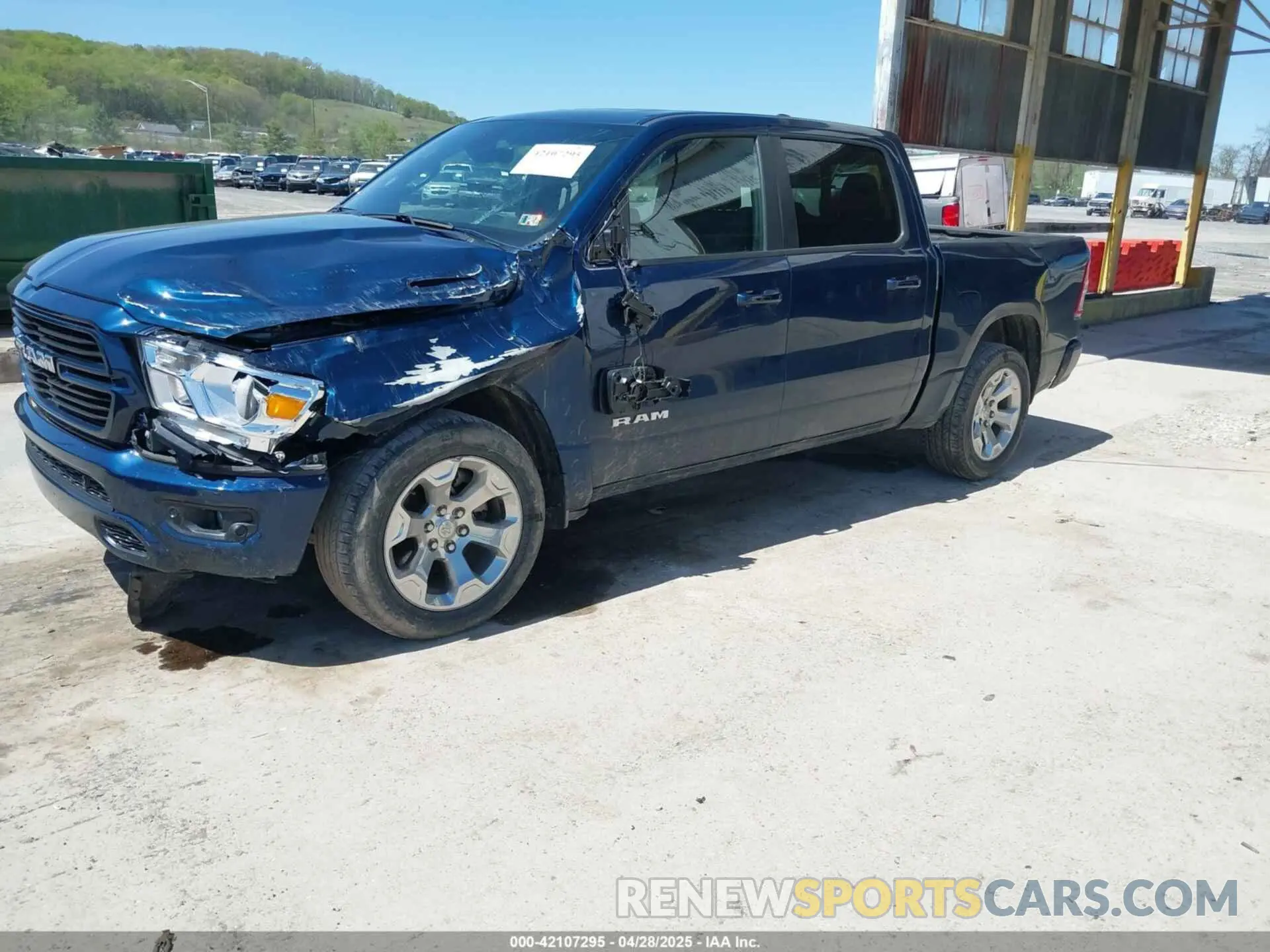 2 Photograph of a damaged car 1C6SRFFT6MN827214 RAM 1500 2021