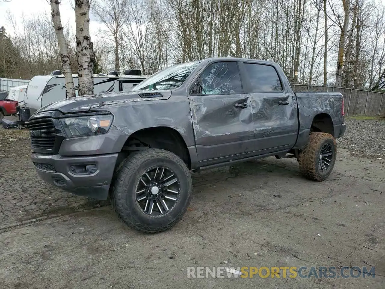 1 Photograph of a damaged car 1C6SRFFT7MN511174 RAM 1500 2021