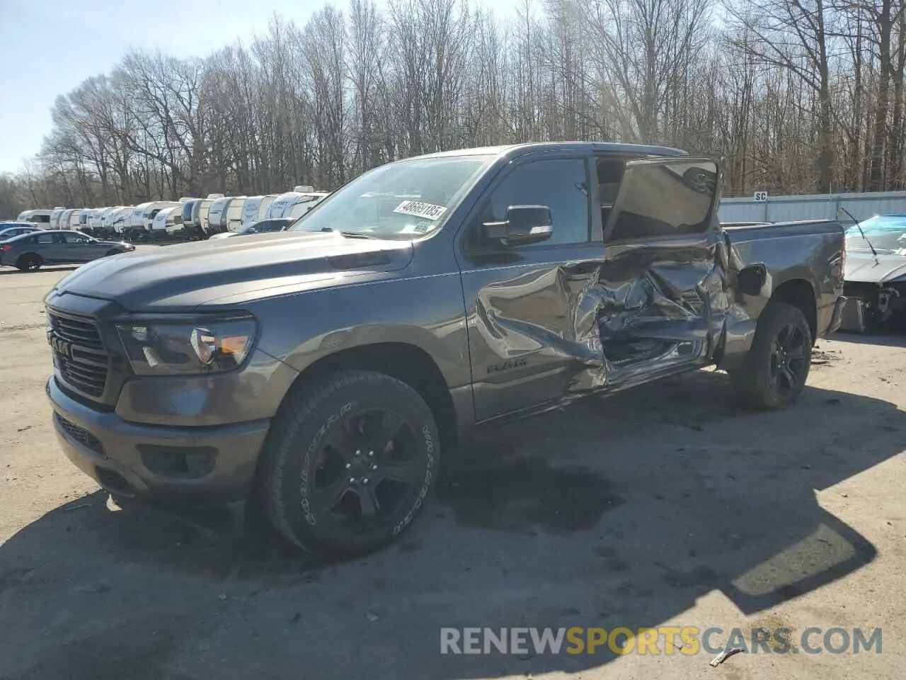 1 Photograph of a damaged car 1C6SRFFT7MN576011 RAM 1500 2021